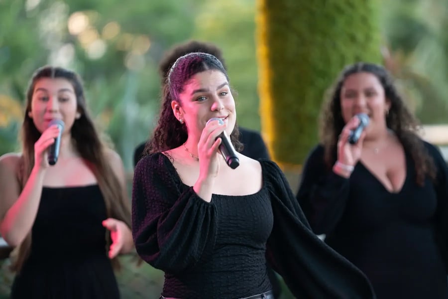 Women singing at the Pathfinders conference.